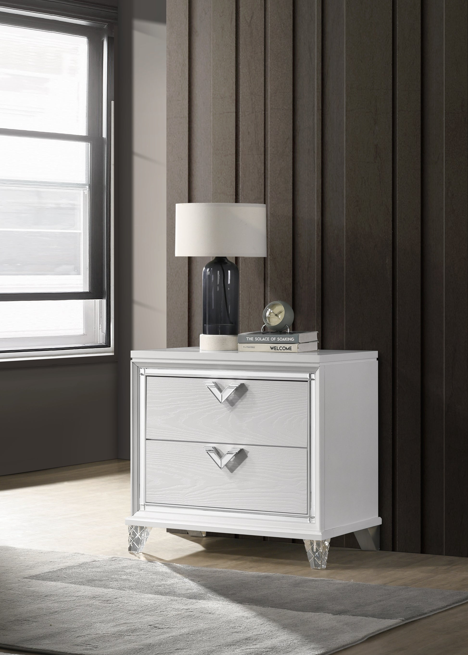 White twodrawer nightstand with mirrored trim and crystal legs
