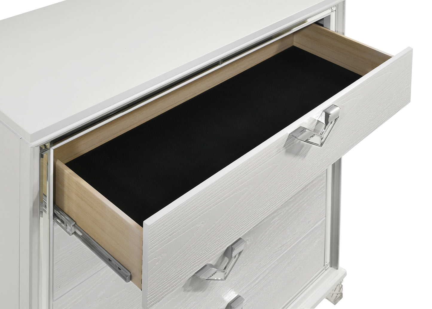 Open white wood grain dresser drawer with black felt lining and crystal pull