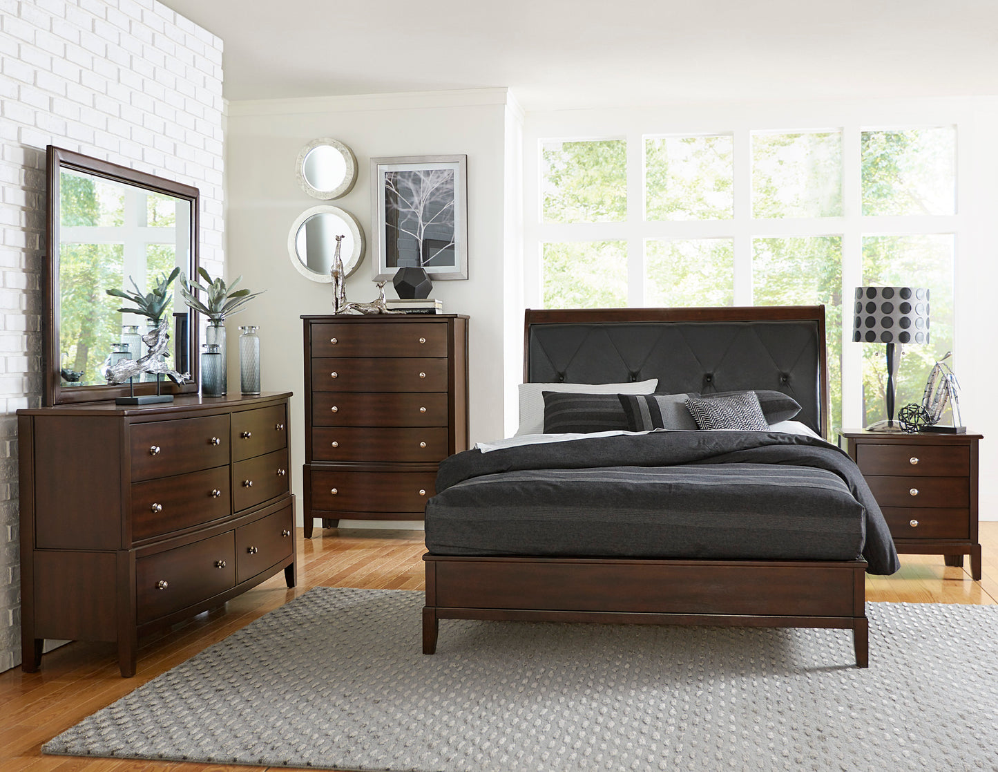 Dark wood dresser with six drawers and silver knobs