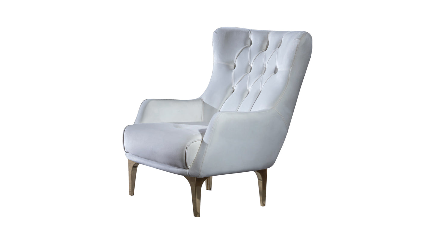 White tufted wingback armchair with gold tapered legs