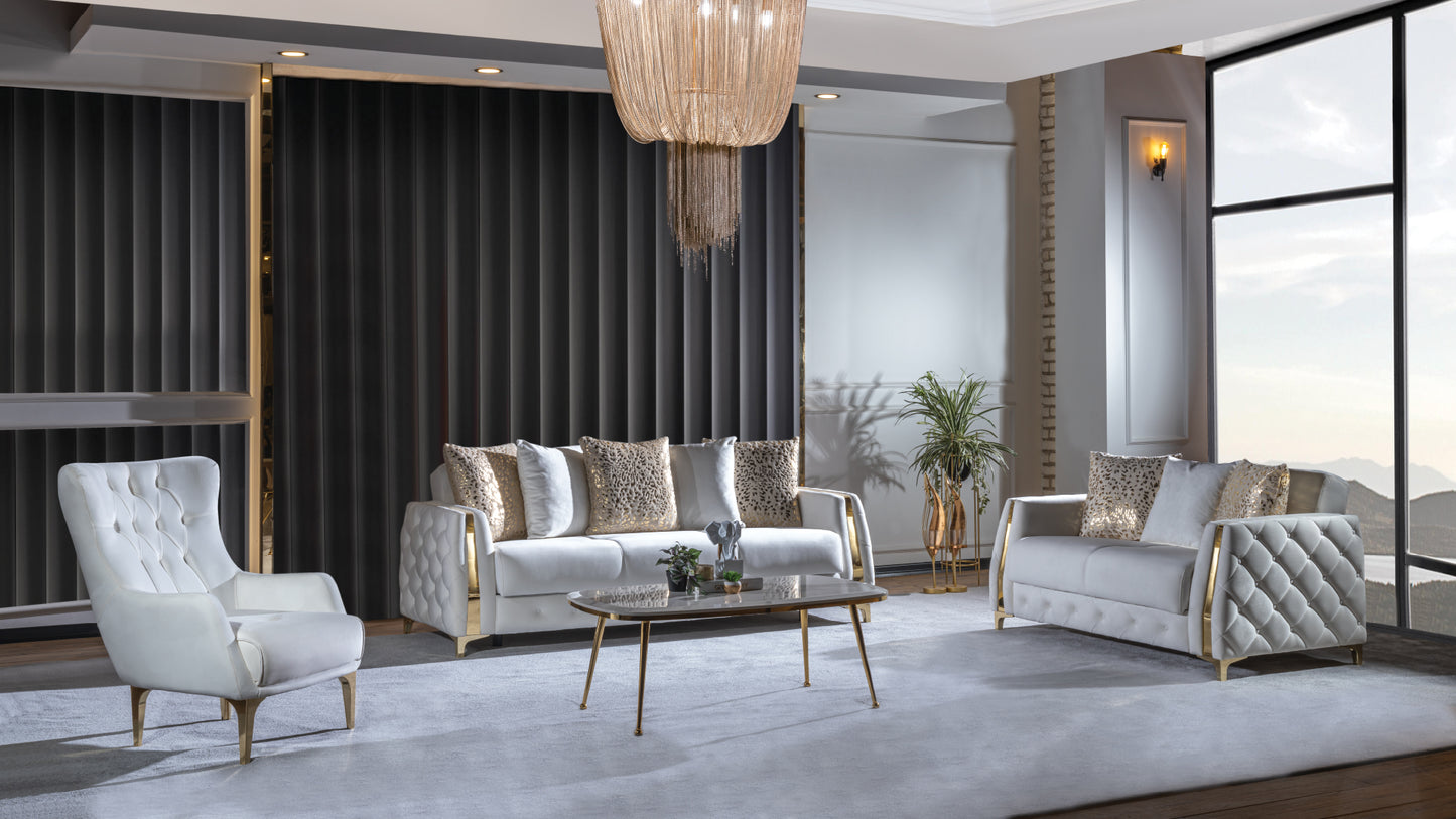 Luxurious white velvet armchair with tufted detailing and gold accents perfect for a modern living room