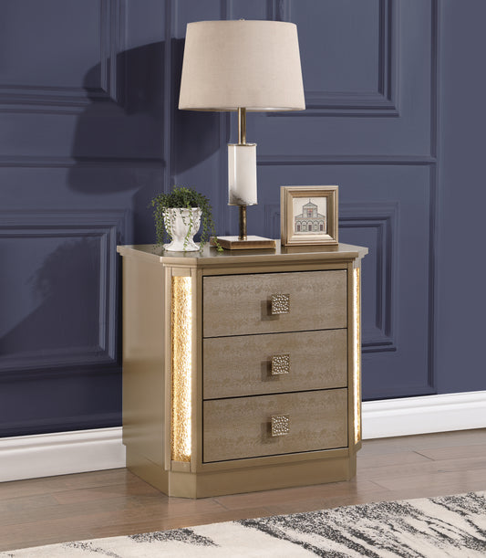 Glamorous gold nightstand with three textured drawers and LED lighting