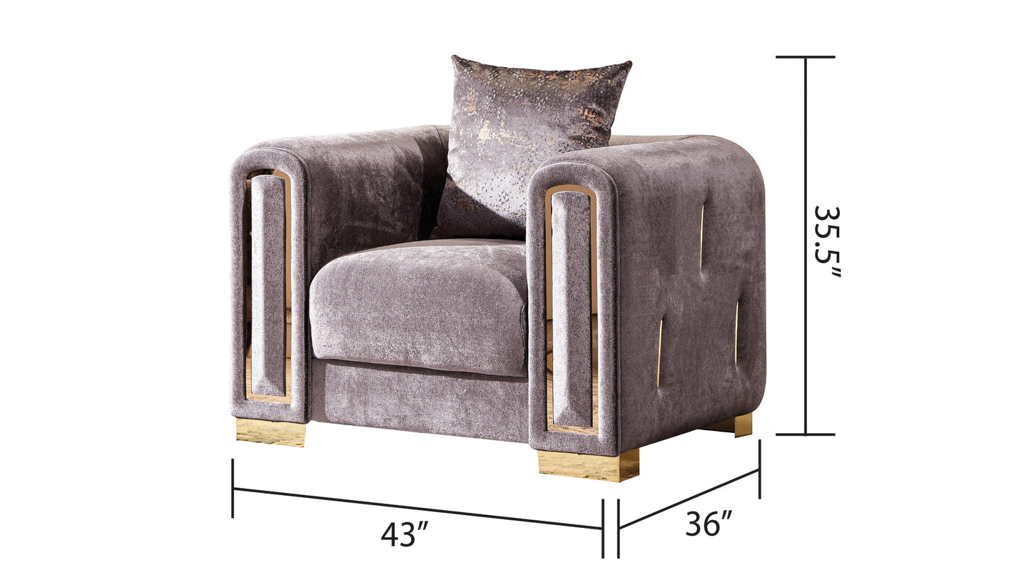 Plush velvet armchair in dusty rose with gold metallic accents and tufted detailing