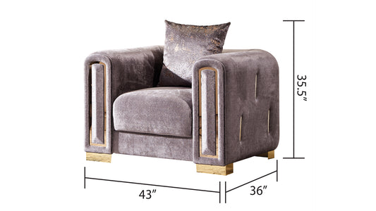 Plush velvet armchair in dusty rose with gold metallic accents and tufted detailing