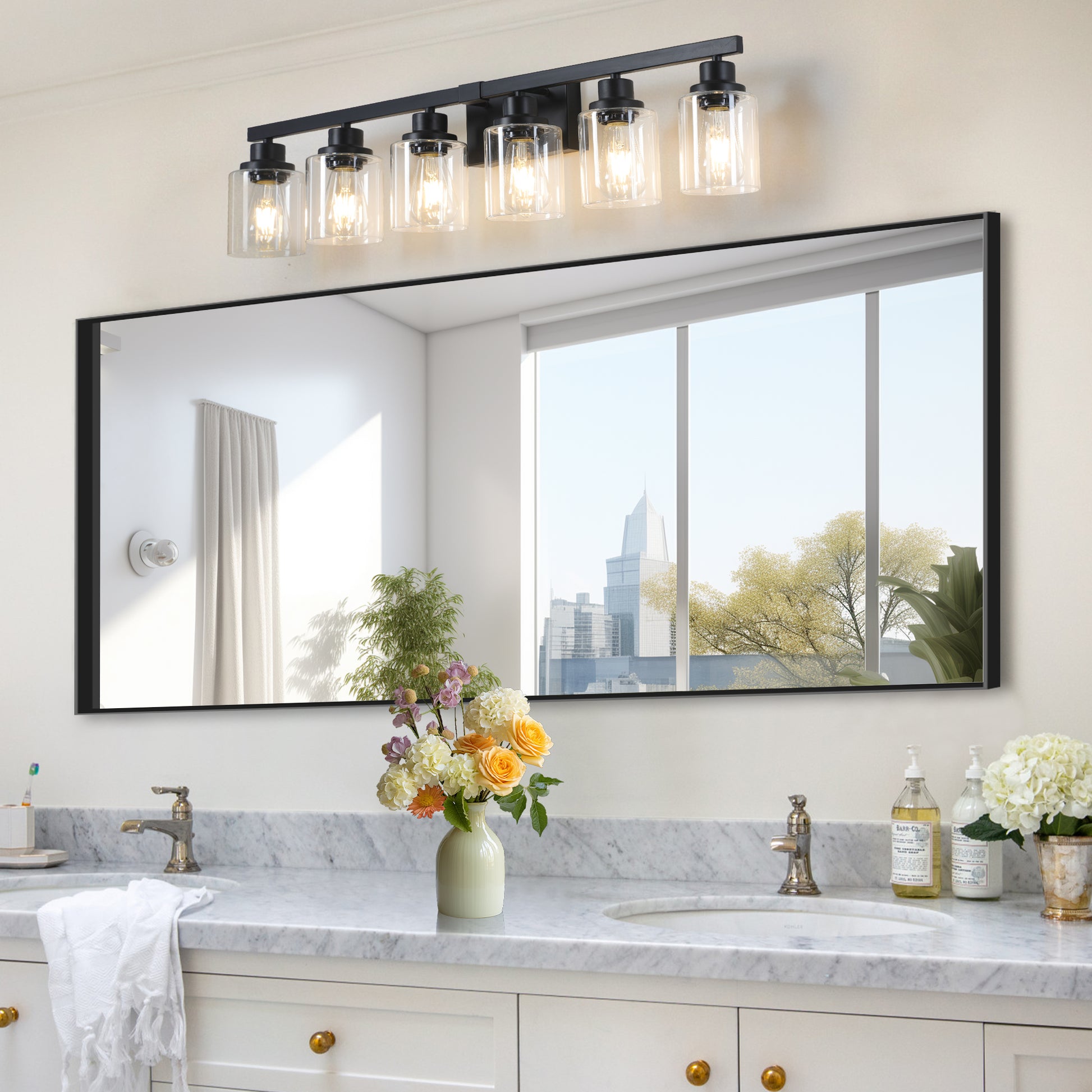Fivelight black vanity light fixture with clear glass shades above a bathroom mirror