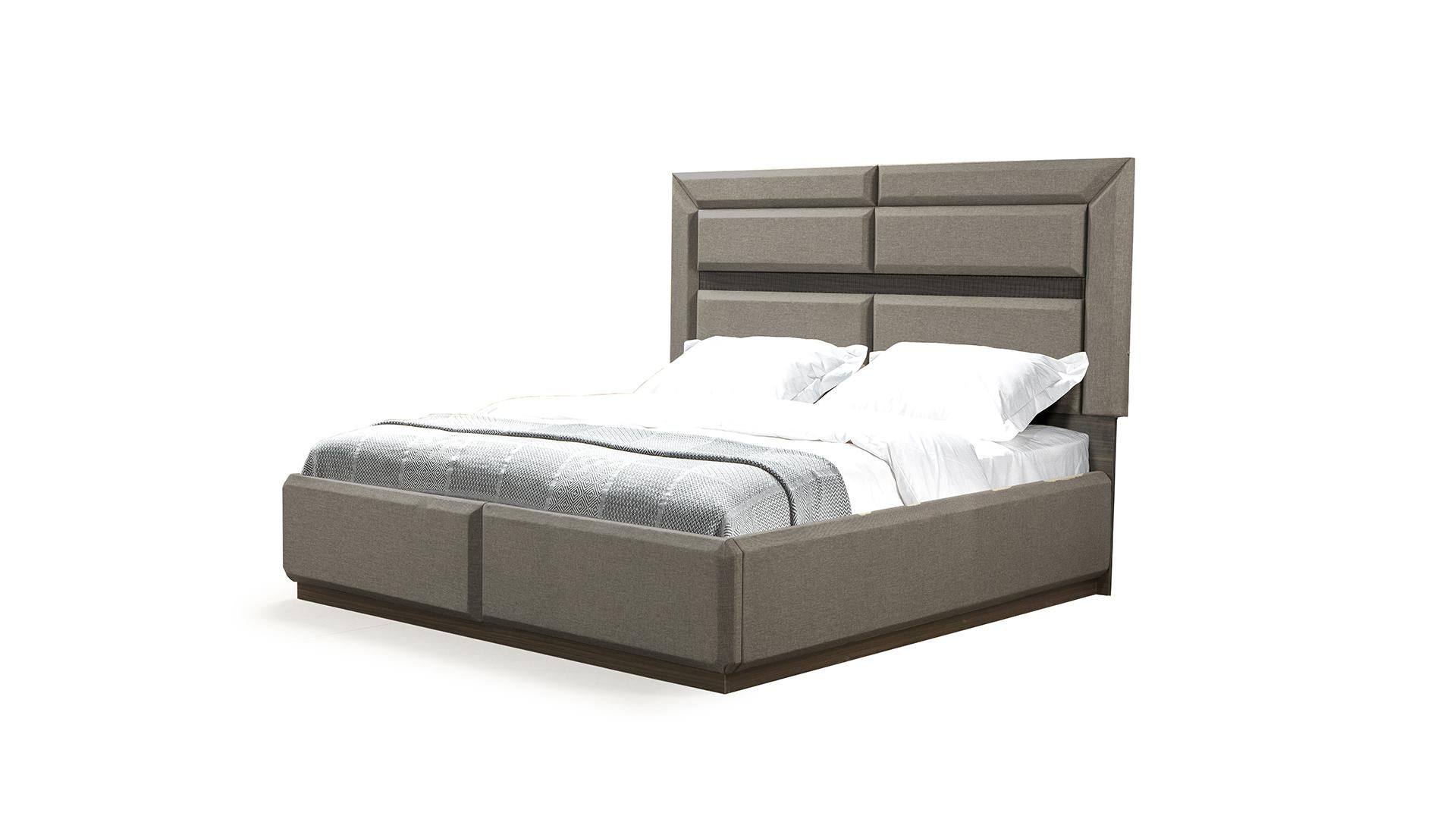 Modern upholstered grey king bed with a geometric headboard and dark wood base perfect for contemporary bedrooms