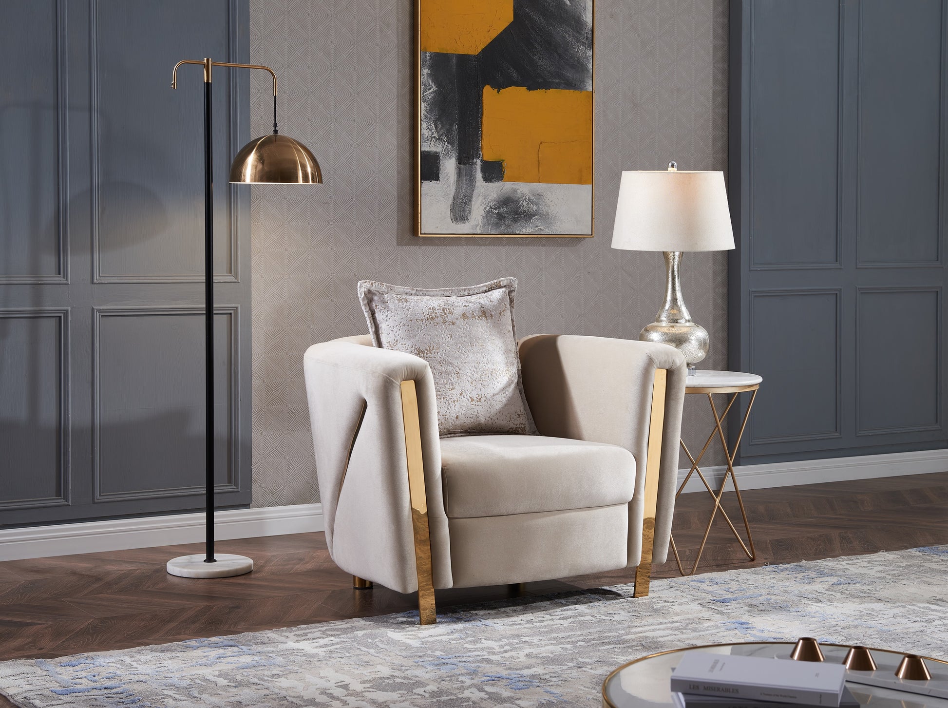 Plush beige velvet armchair with gold accents and decorative throw pillow perfect for modern living room decor