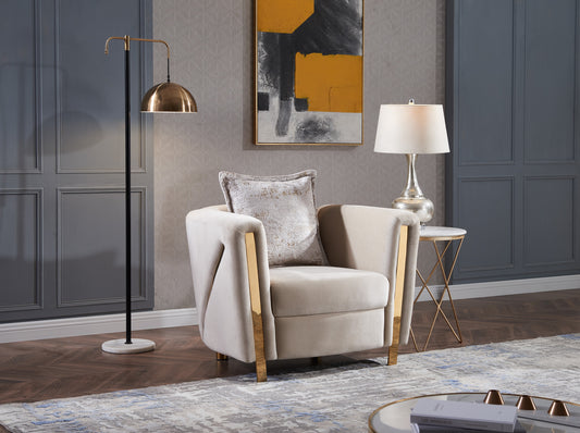 Plush beige velvet armchair with gold accents and decorative throw pillow perfect for modern living room decor