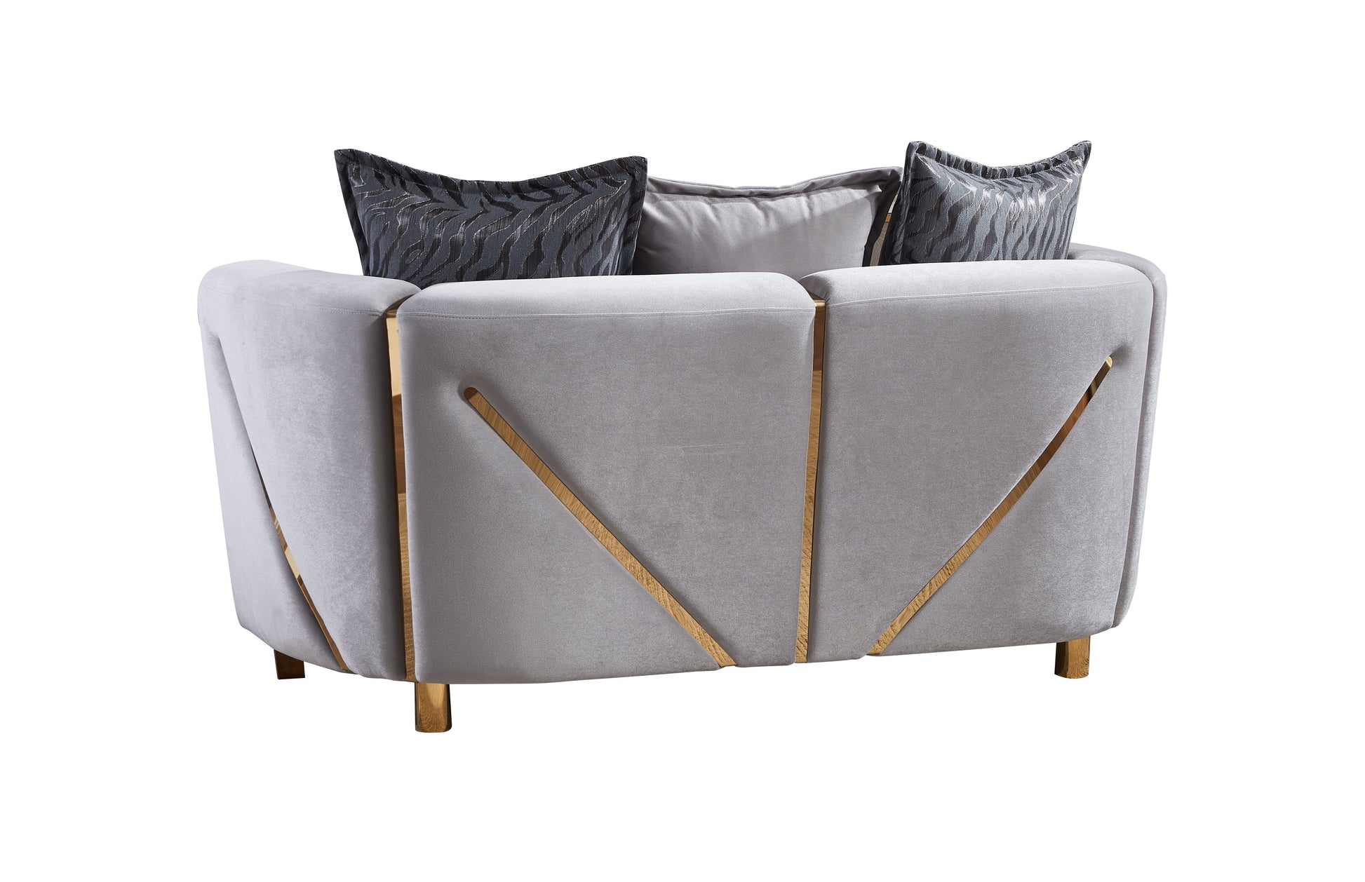 Elegant grey velvet armchair with decorative gold accents and patterned cushions