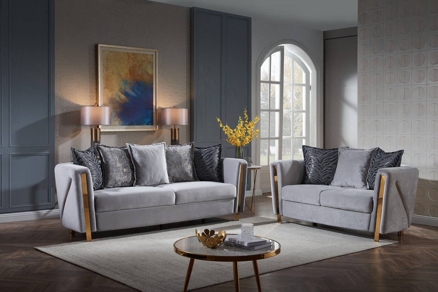Grey velvet sofa set with gold accents and designer throw pillows for living room