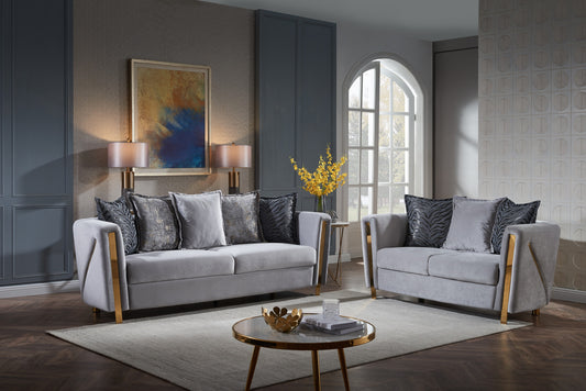 Grey velvet sofa set with gold accents and designer throw pillows for living room