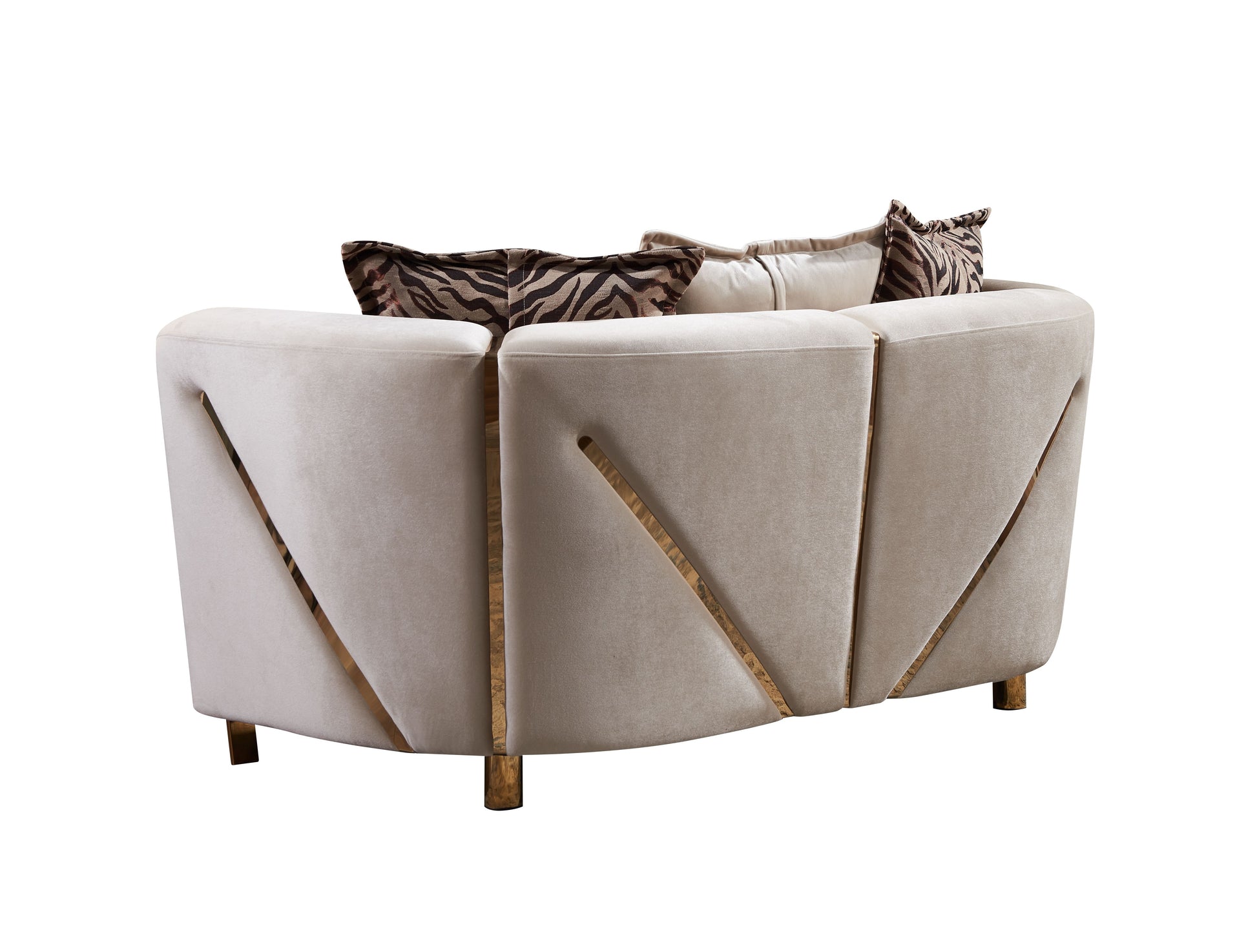 Modern beige velvet sofa with striking gold accents and zebra print cushions