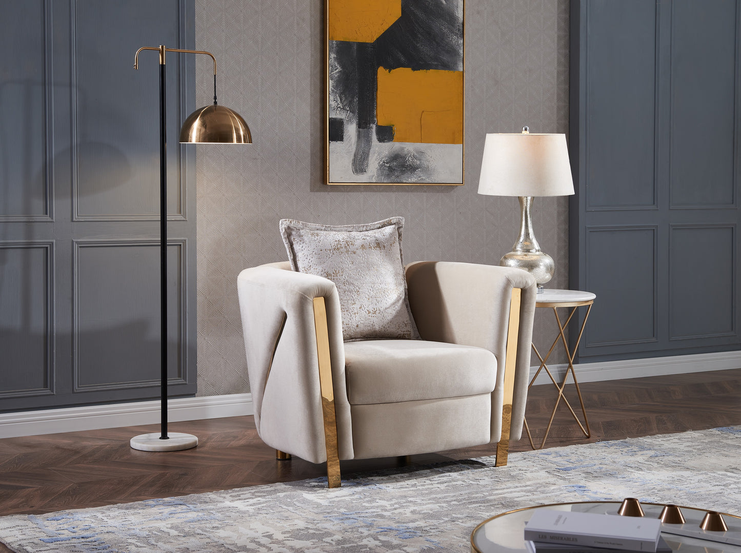 Elegant cream velvet armchair with gold accents and ornate decorative pillow
