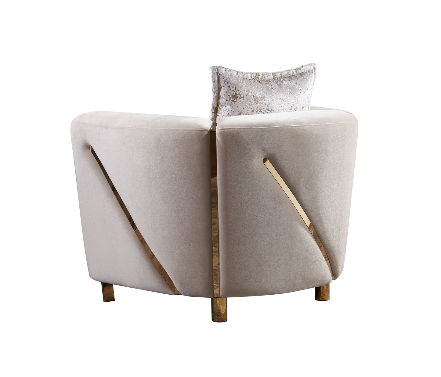 Cream velvet armchair with gold accents and decorative pillow