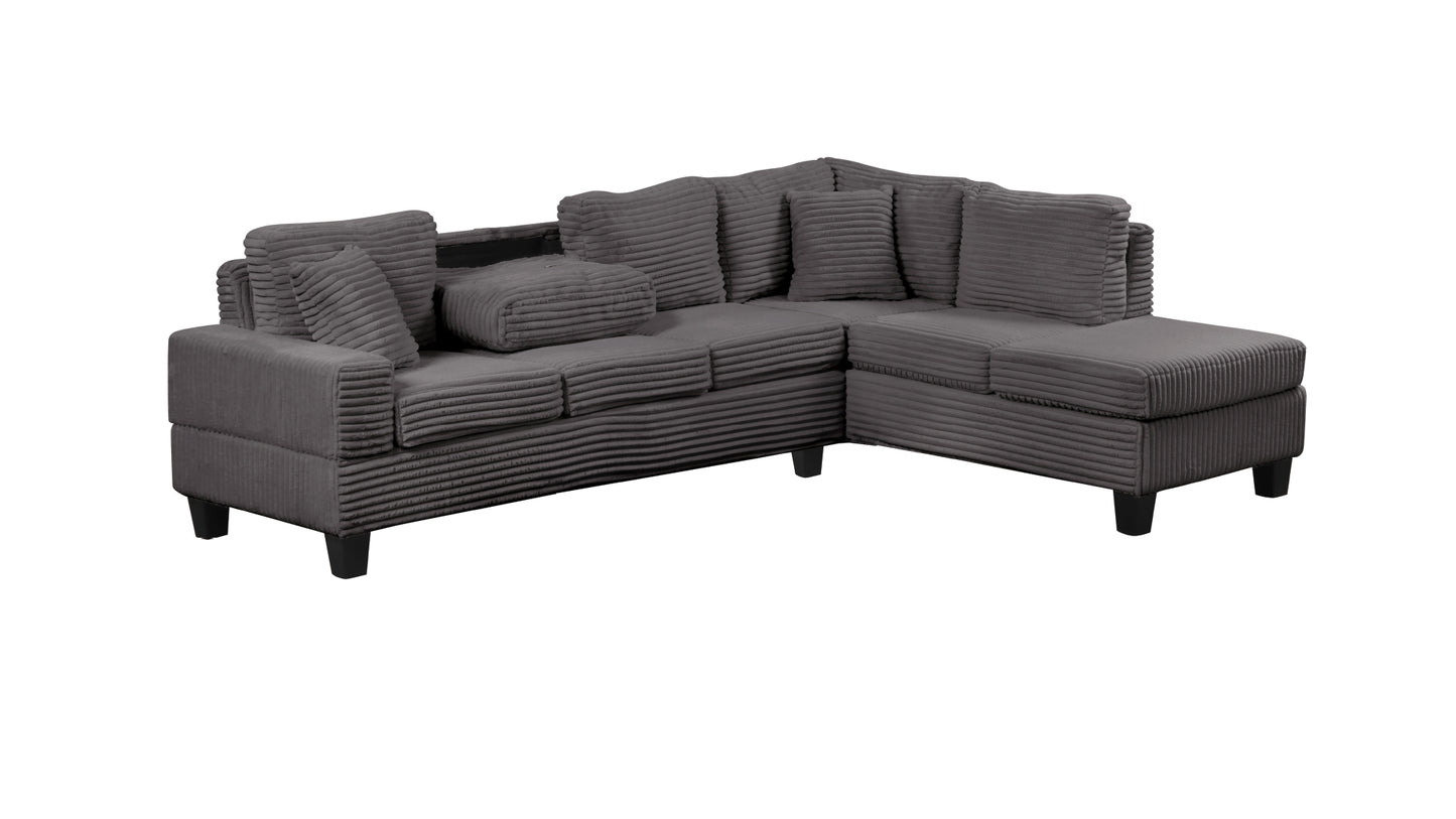 Grey corduroy sectional sofa with plush cushions and black wooden legs