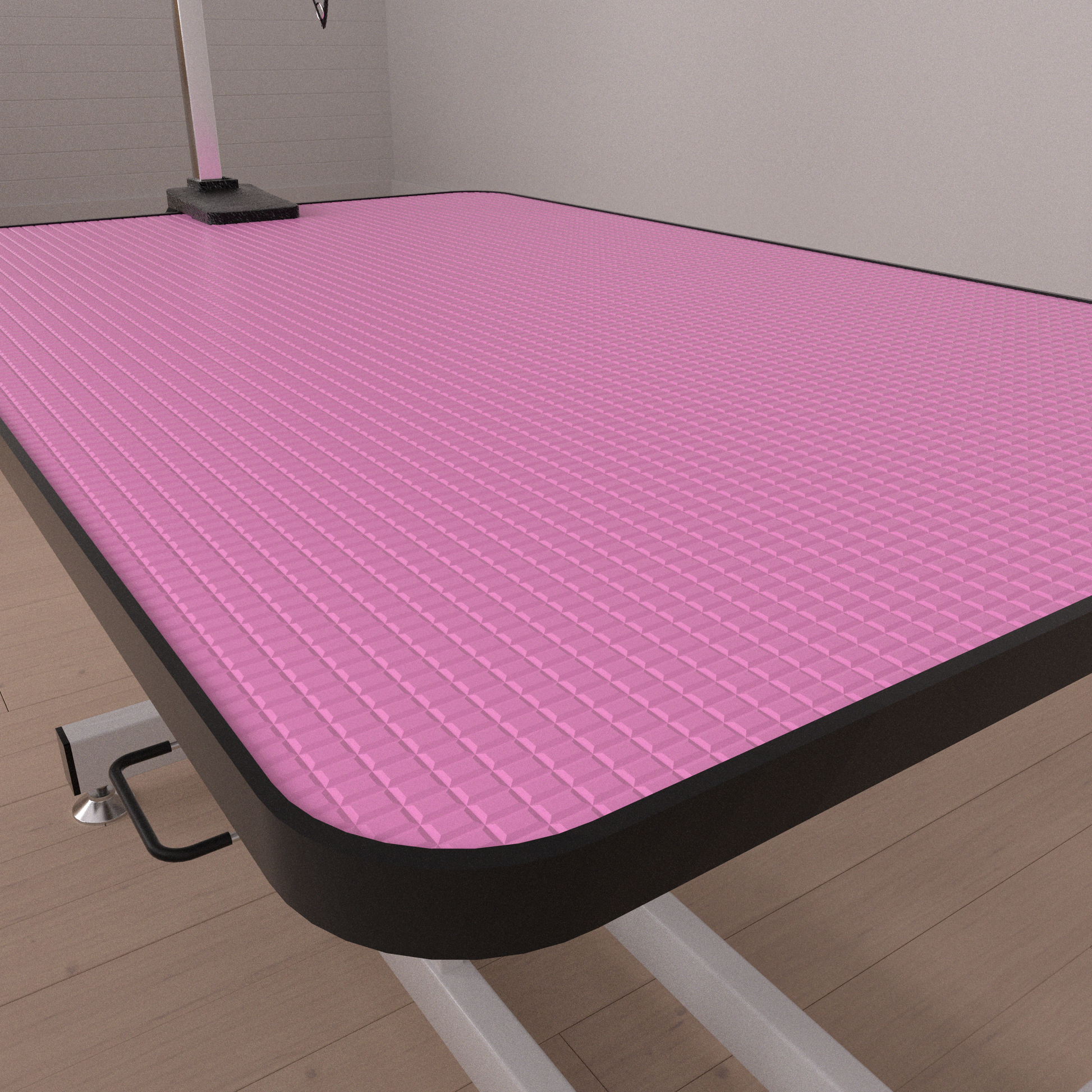 Pink textured mat on a grooming table with a black edge ideal for pet salons
