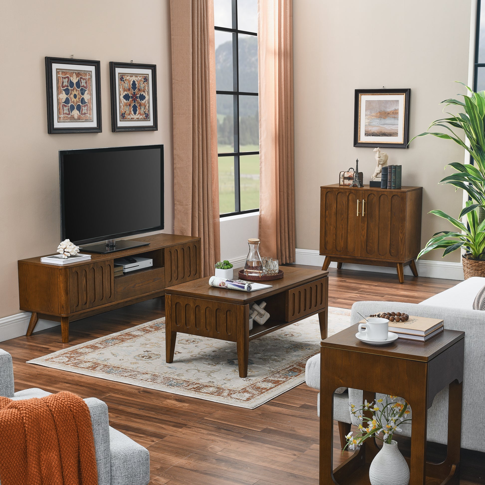 Midcentury modern brown wood TV stand with fluted doors holding a TV and decor