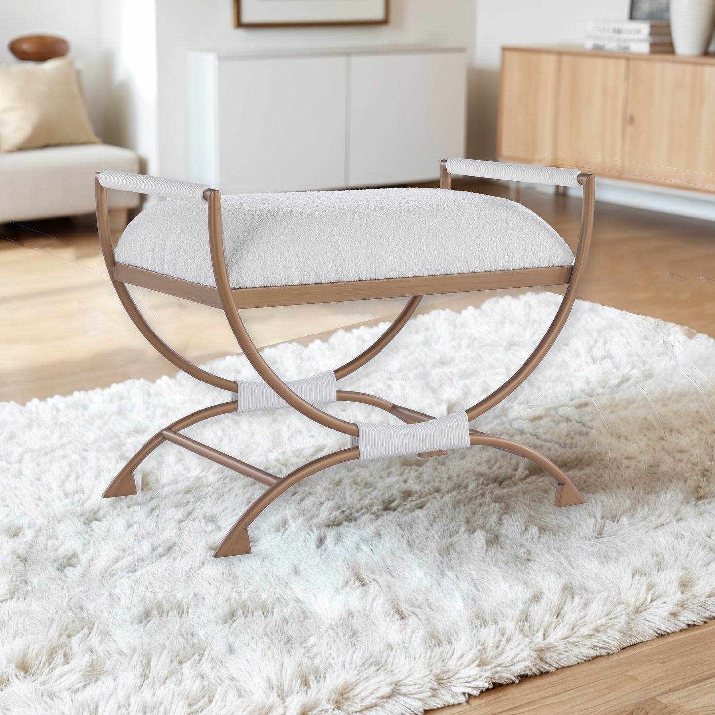 Luxurious white boucle accent stool with gold metal legs and white rope detailing