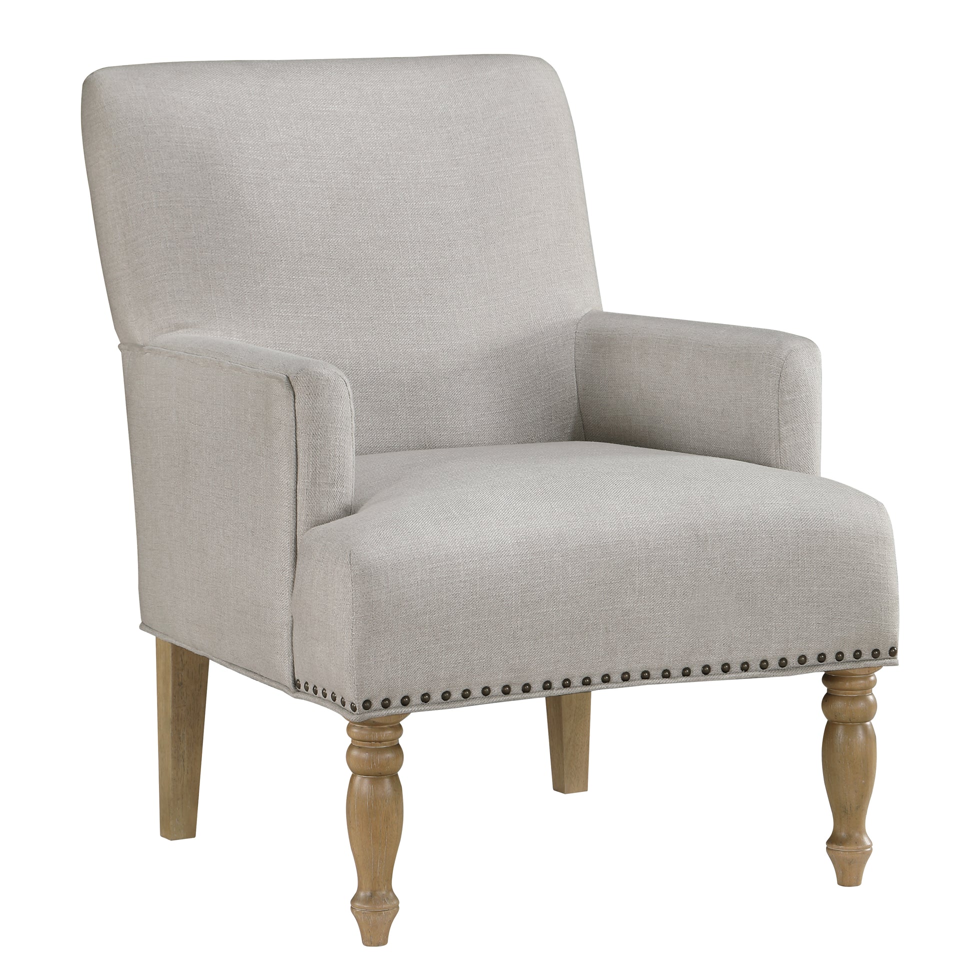 Light gray upholstered armchair with nailhead trim and turned wood legs