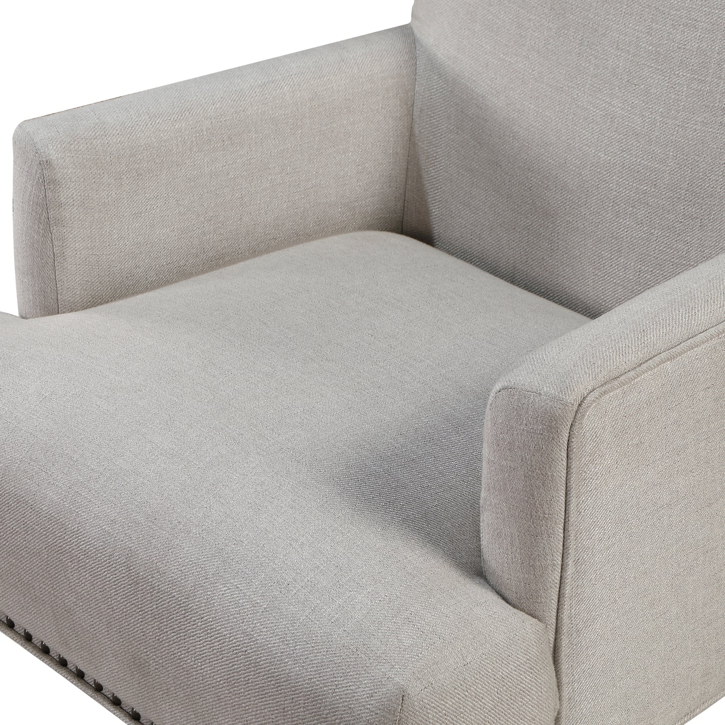 Light grey upholstered armchair with decorative nailhead trim on the base