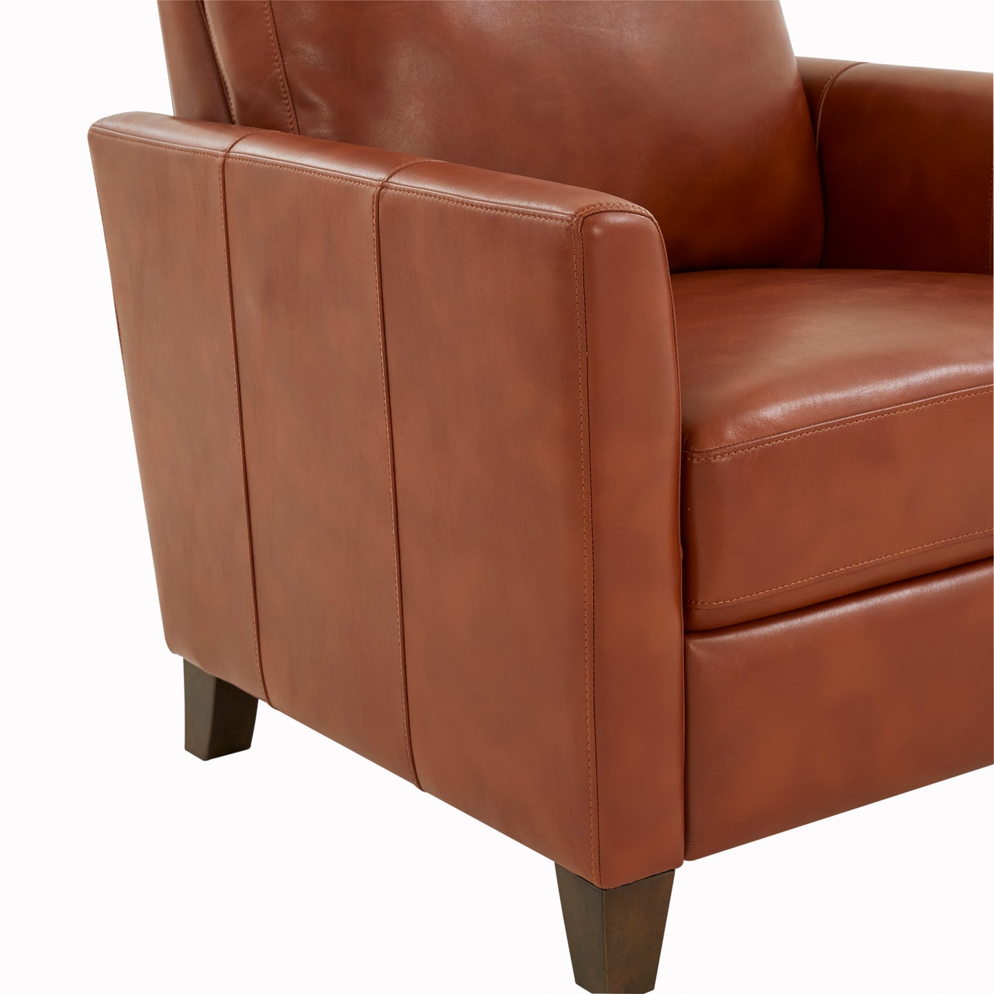 Closeup of a warm brown leather armchair armrest with visible stitching details