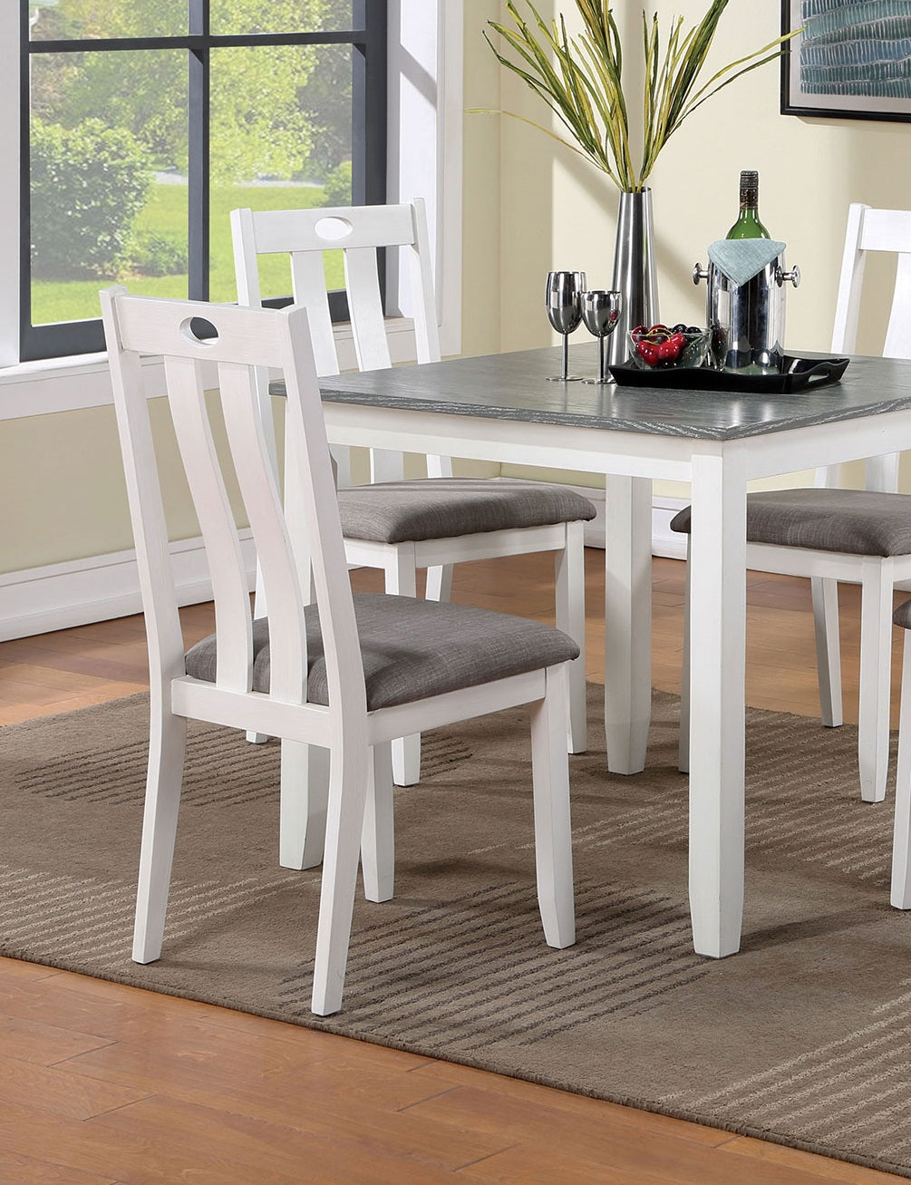 White wooden dining chair with grey upholstered seat and oval cutout detail