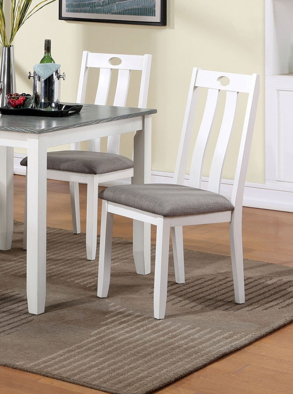 White wooden dining chair with grey upholstered seat and slatted back