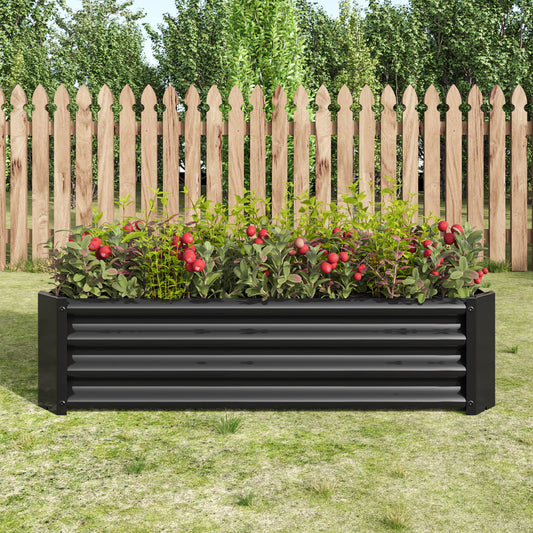 Black corrugated metal raised garden bed filled with lush plants and red berries