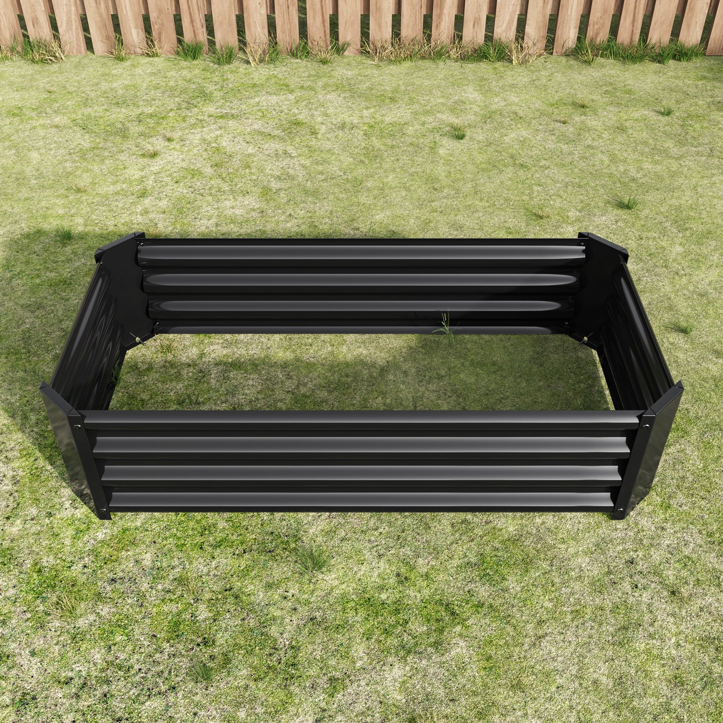 Hexagonal black metal raised garden bed with ribbed texture ready for planting