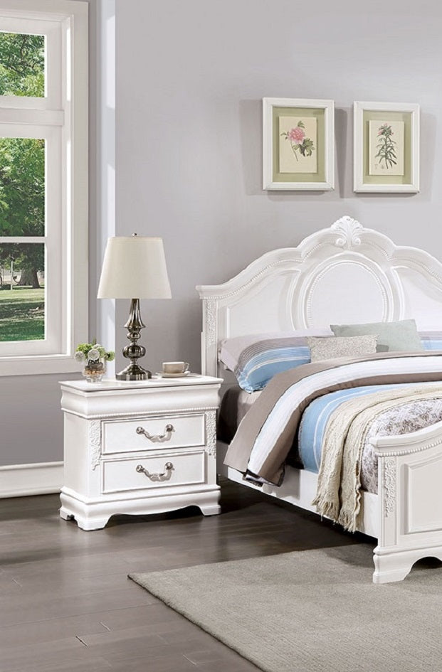 Ornate white nightstand with two drawers and vintagestyle pulls perfect for a bedroom