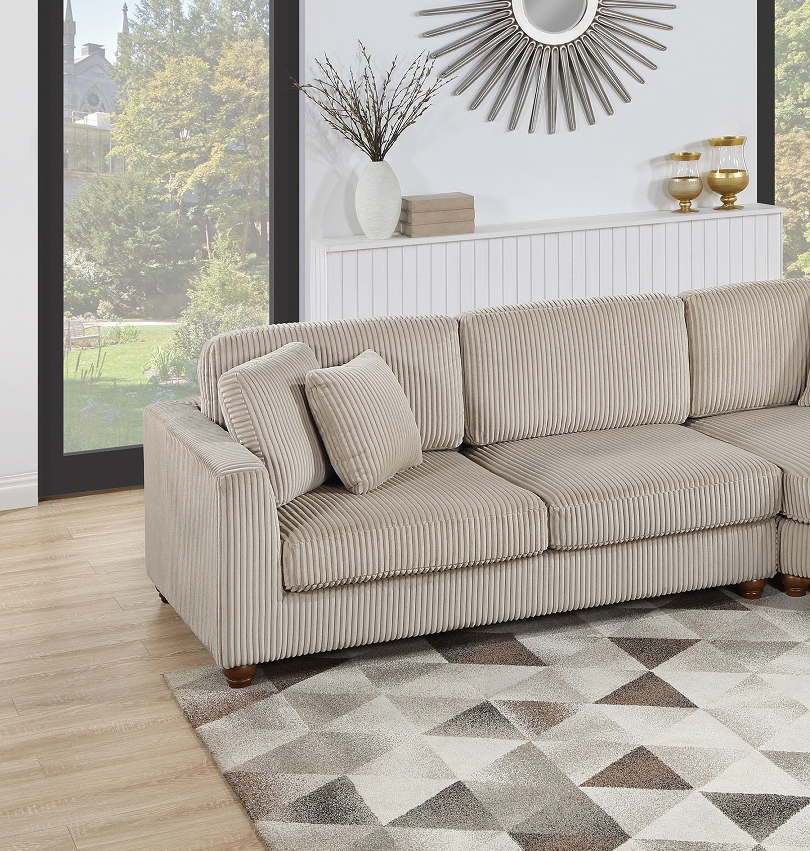 Beige corduroy sectional sofa with plush cushions and wooden legs