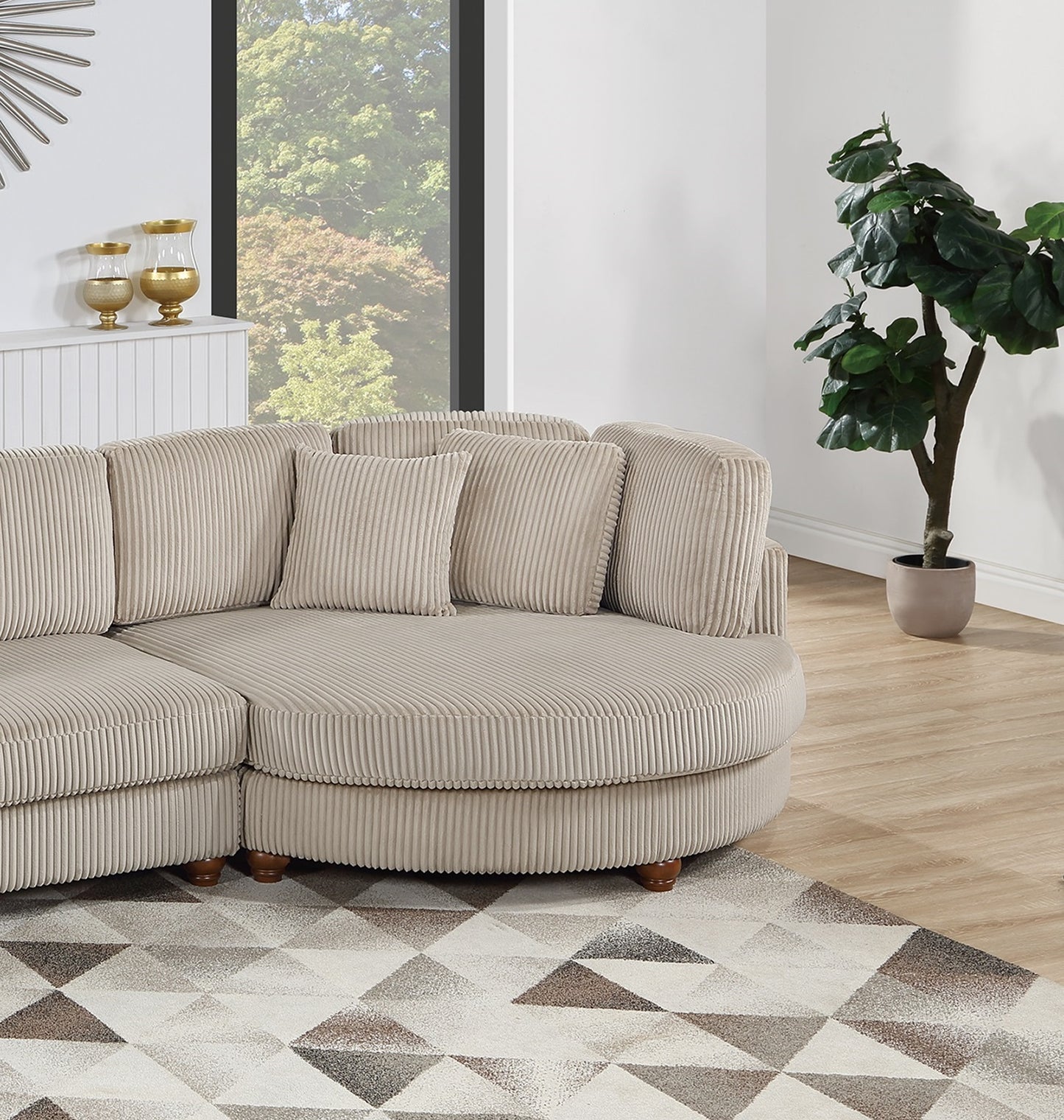 Beige corduroy sectional sofa with plush cushions and rounded chaise lounge