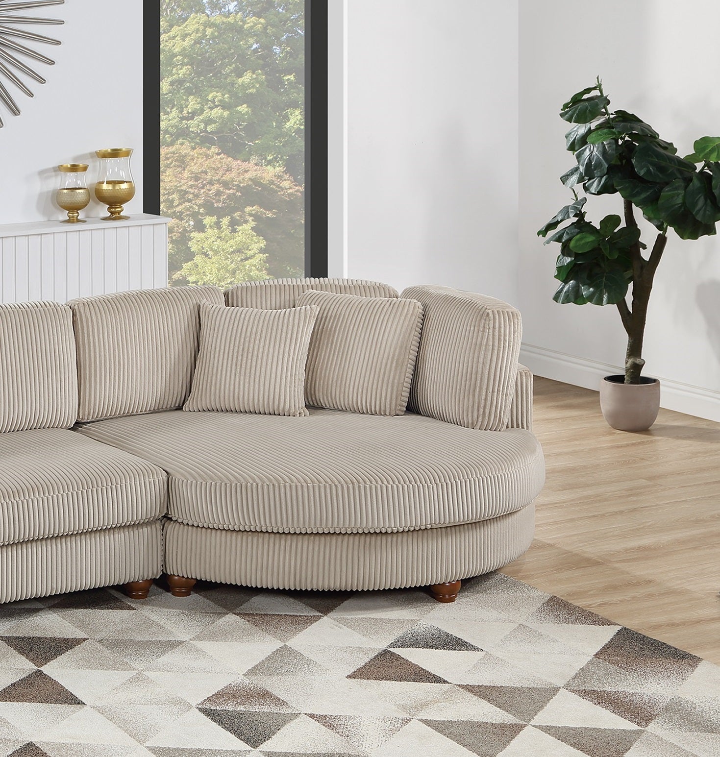 Beige corduroy sectional sofa with plush cushions and rounded chaise lounge