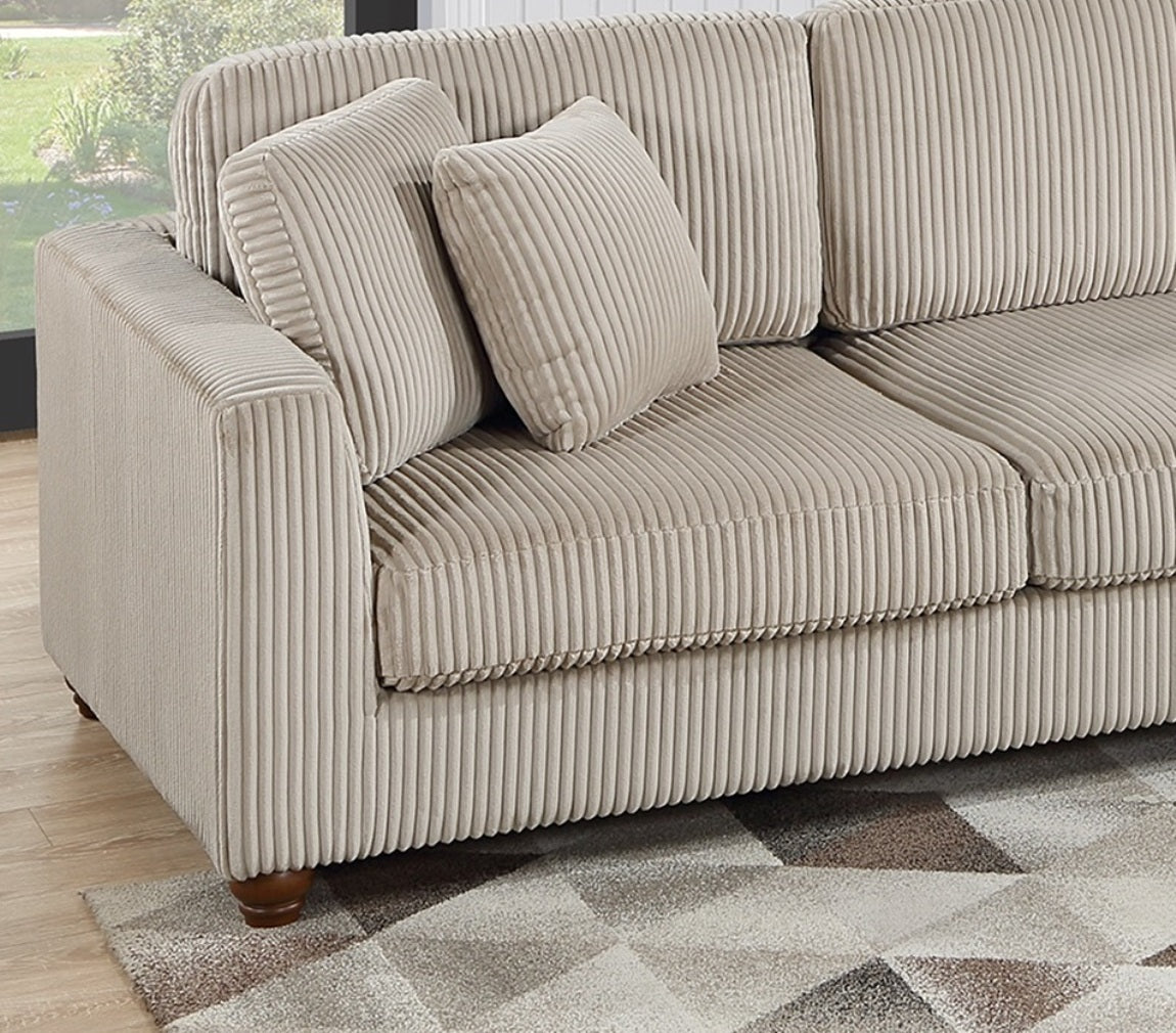 Comfortable beige corduroy sofa with plush throw pillows ideal for modern living rooms