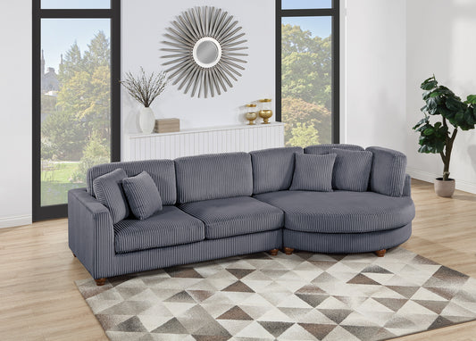 Sectional sofa in dark gray corduroy fabric with plush cushions and wooden legs