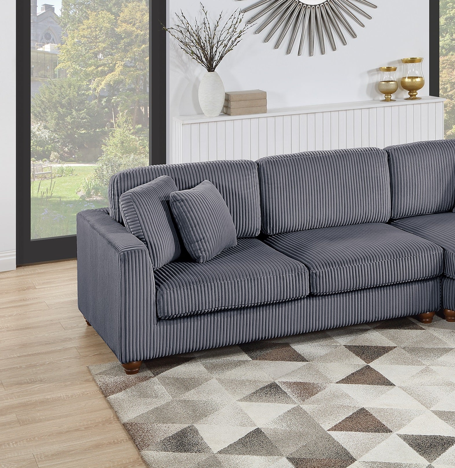 Textured grey corduroy sectional sofa with plush throw pillows