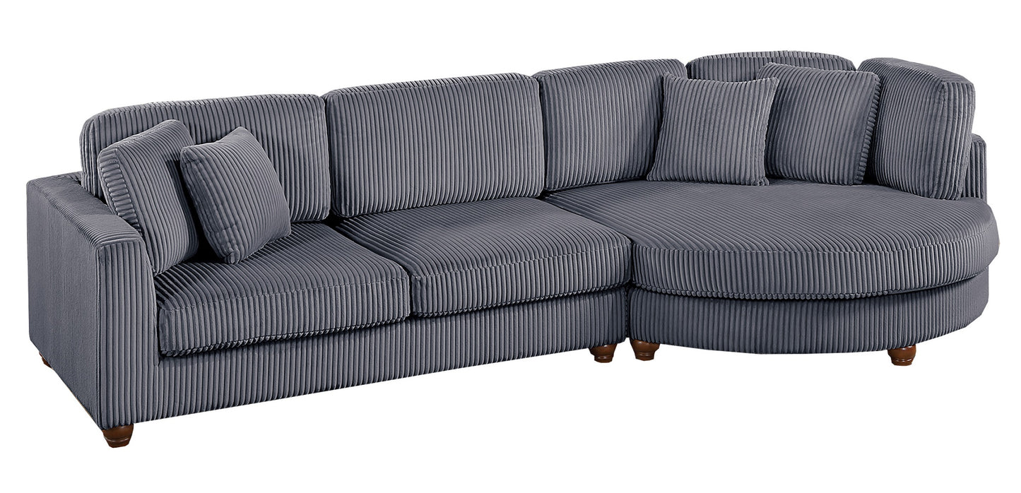 Gray corduroy sectional sofa with plush accent pillows and wooden legs