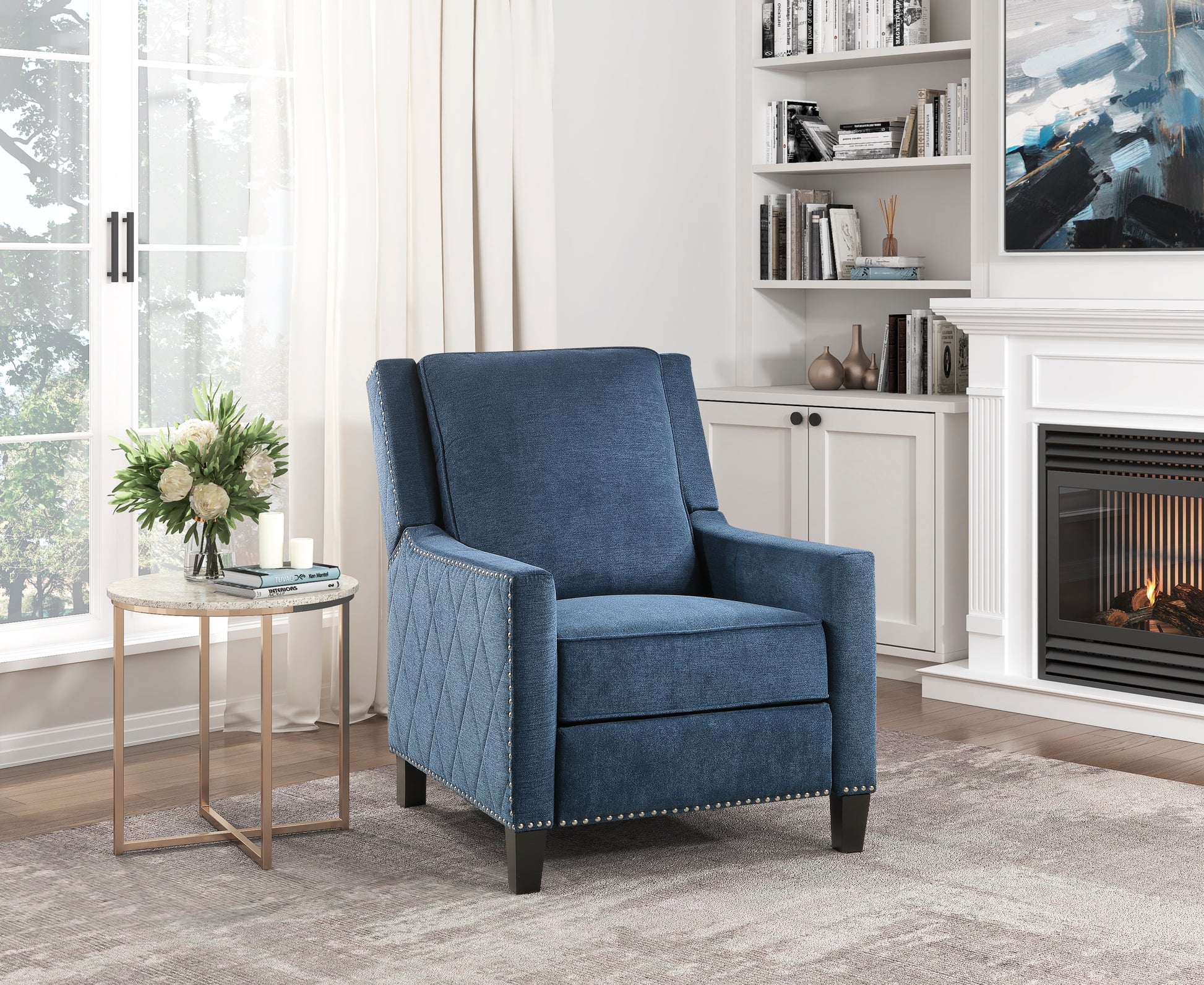 Tufted blue fabric recliner chair with silver nailhead trim perfect for a living room