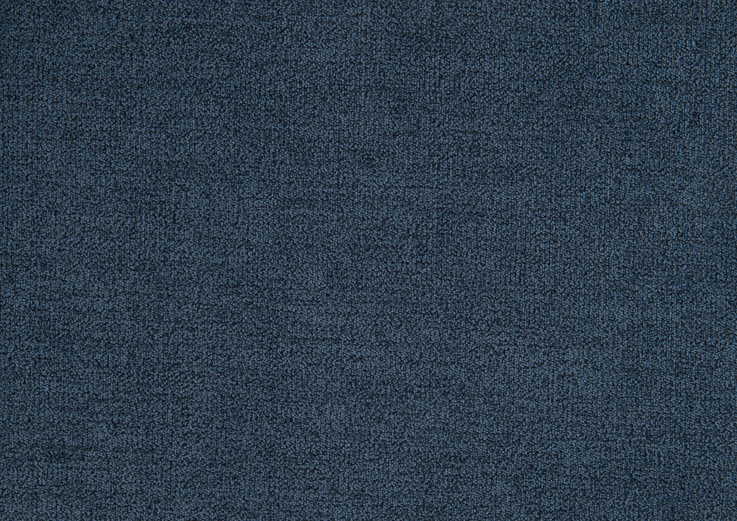 Closeup of textured navy blue carpet with short dense fibers