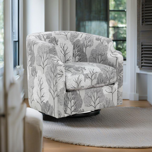 Grey swivel accent chair with a modern tree pattern fabric upholstery