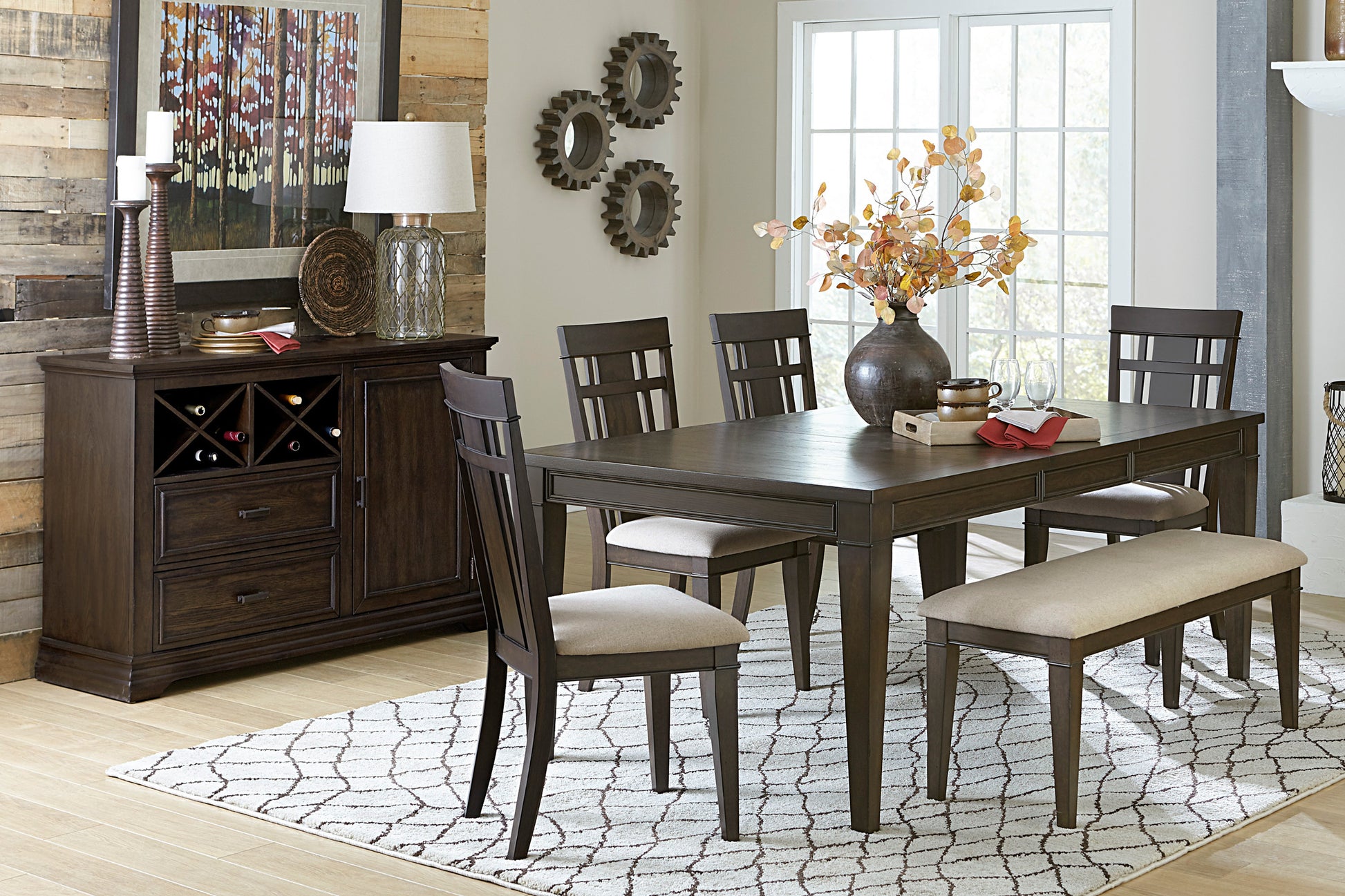 Dark wood dining table set with upholstered bench and chairs