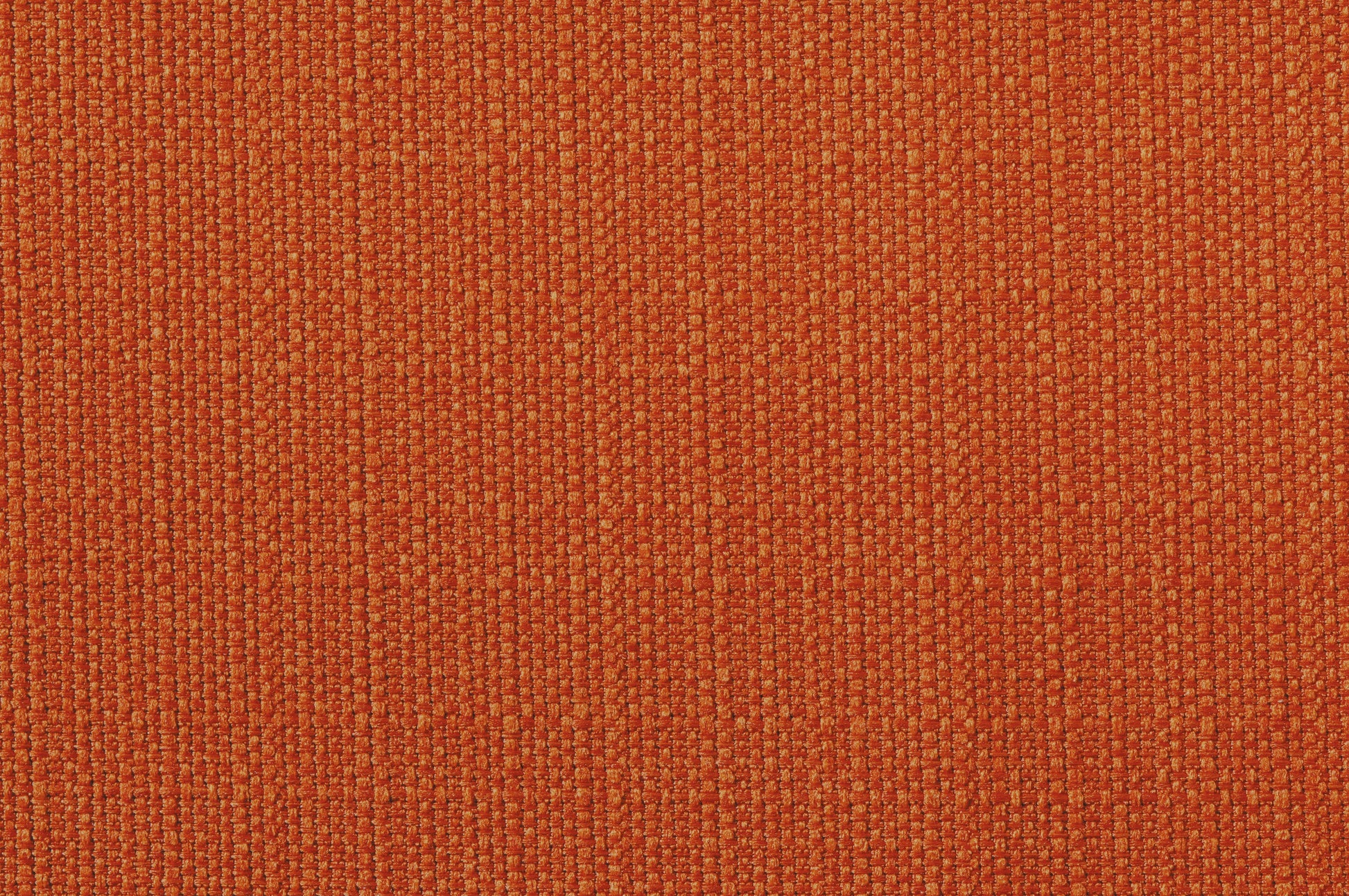 Closeup of textured orange upholstery fabric with woven detail