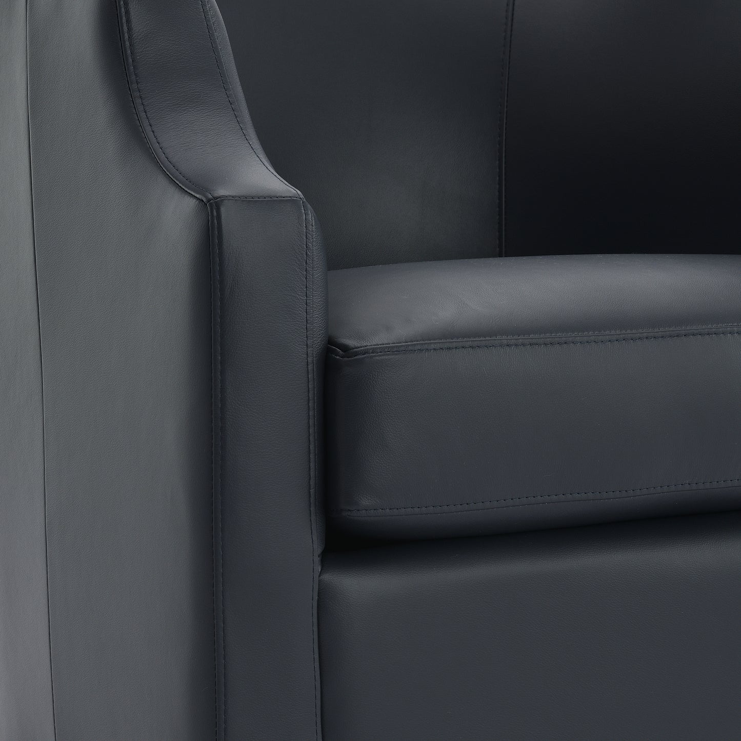 Closeup of a dark grey leather accent chair showing stitching and texture