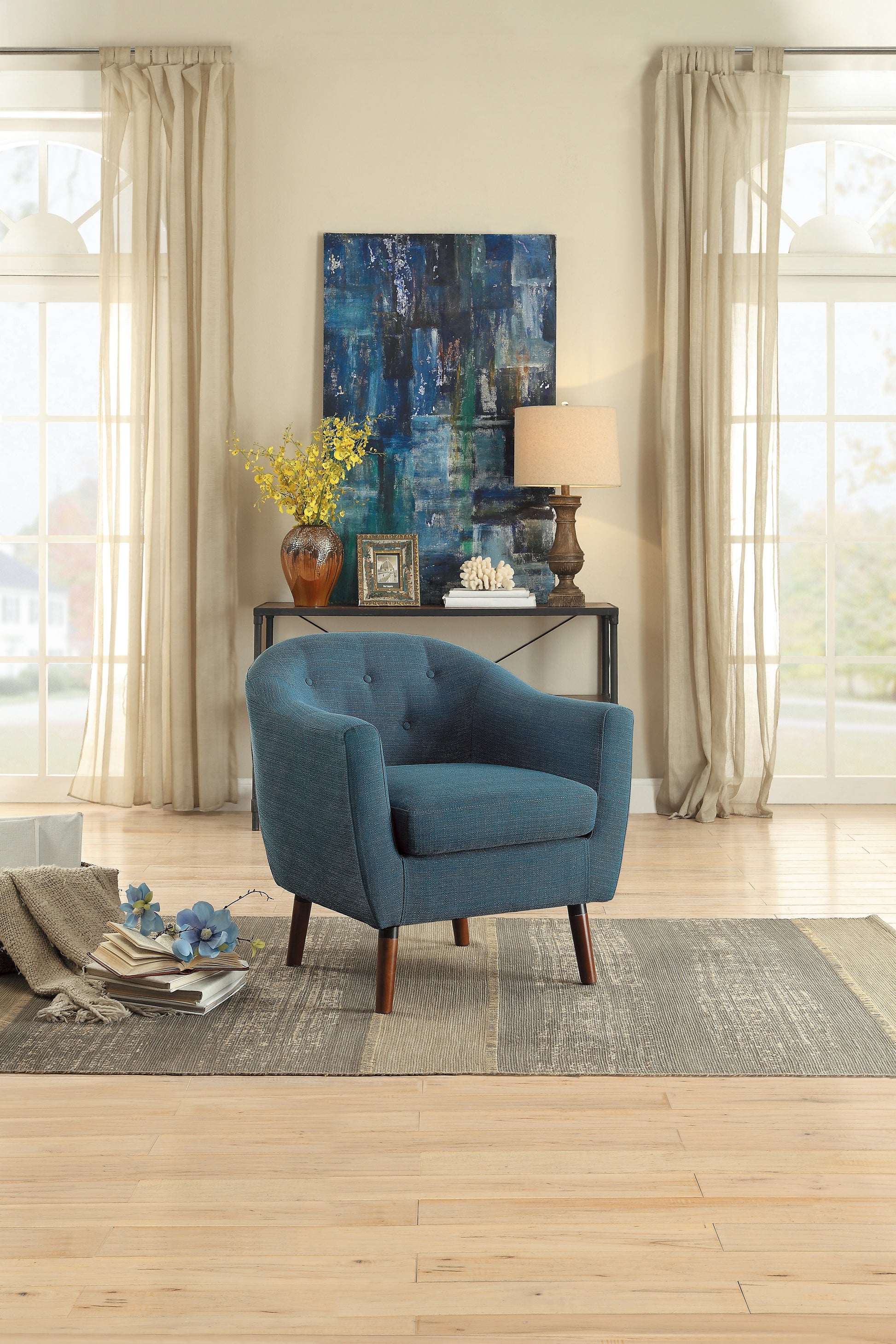 Tufted teal blue accent chair with wooden legs for modern living rooms