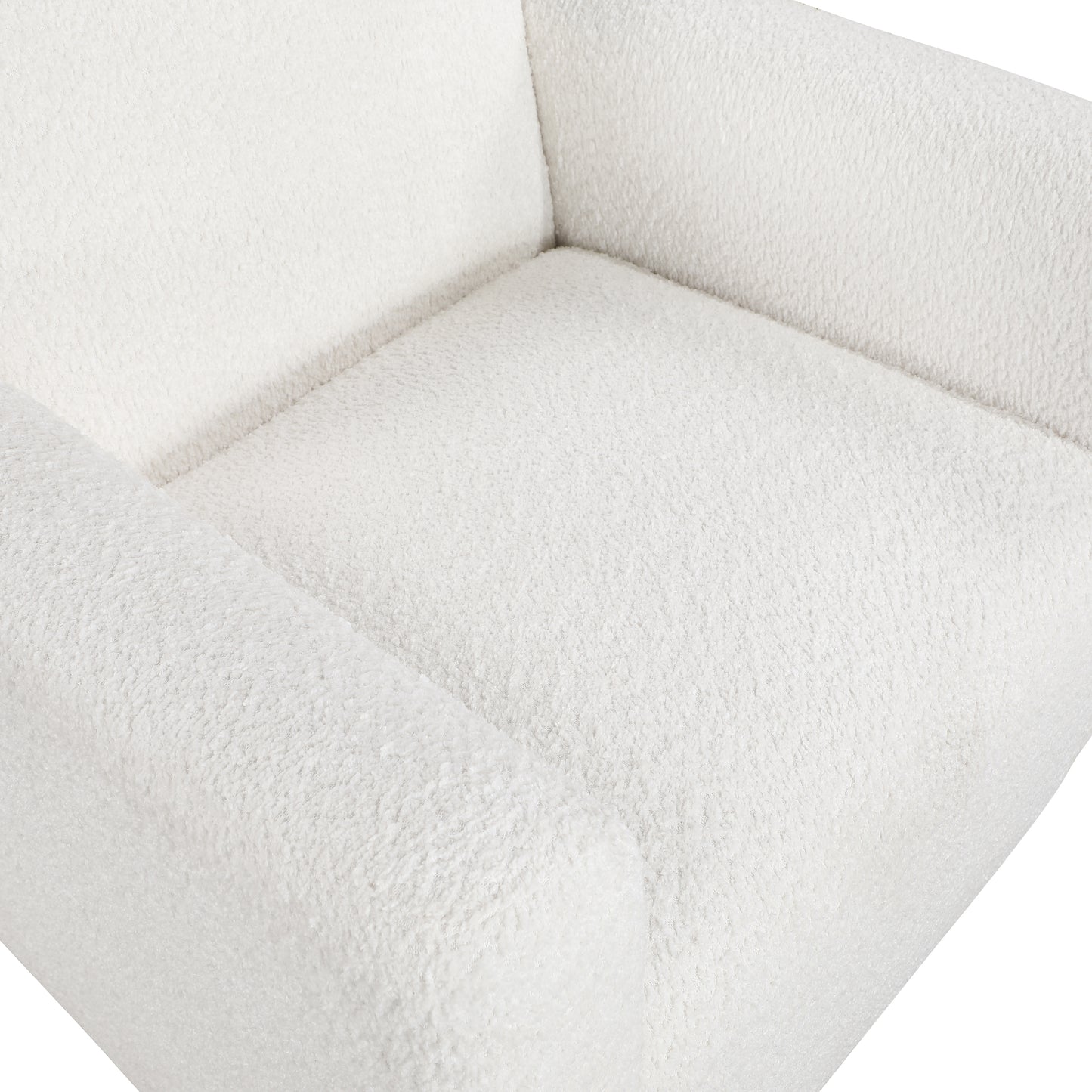 Closeup of plush white sherpa armchair fabric showcasing cozy texture
