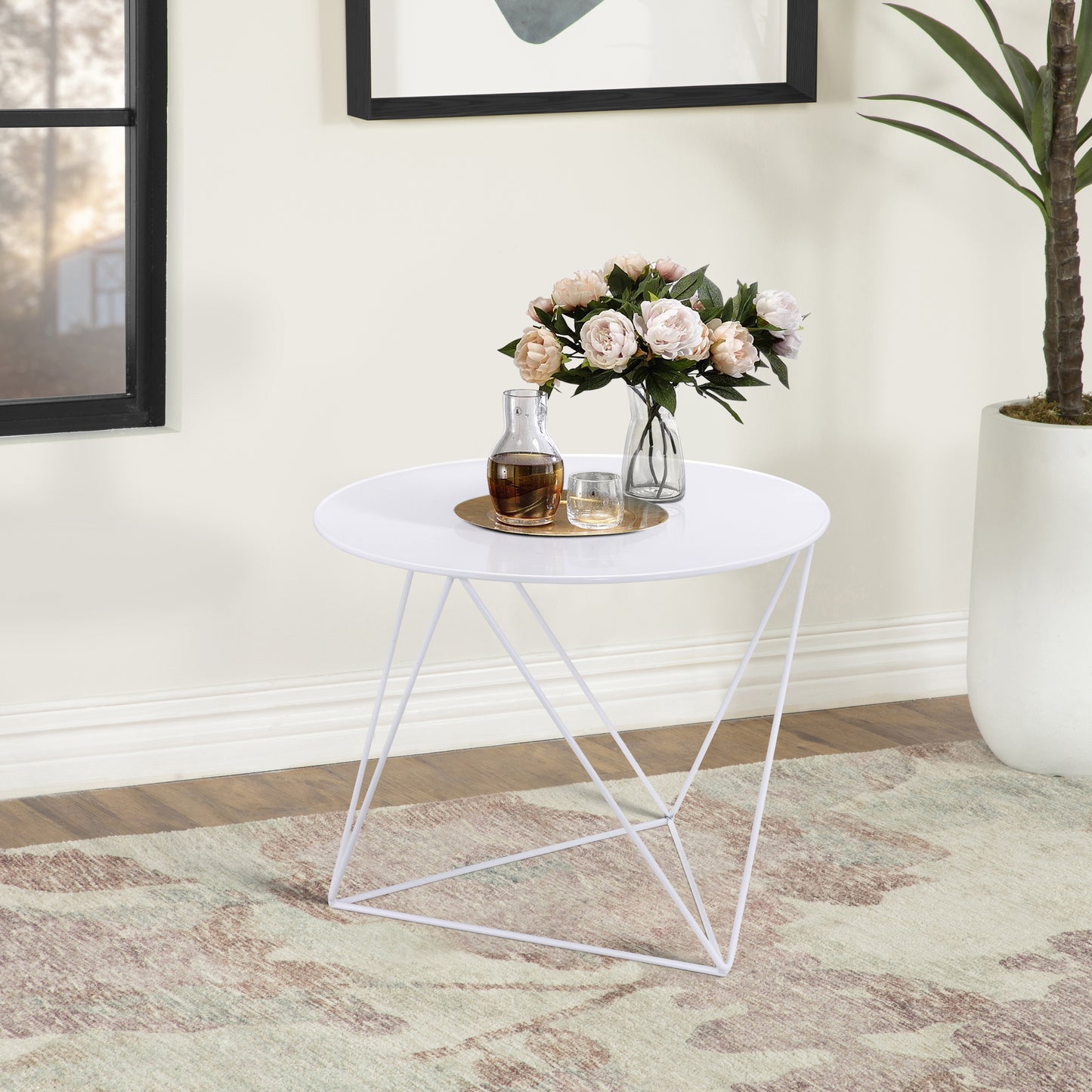 Modern white metal tripod accent table with round top perfect for living rooms
