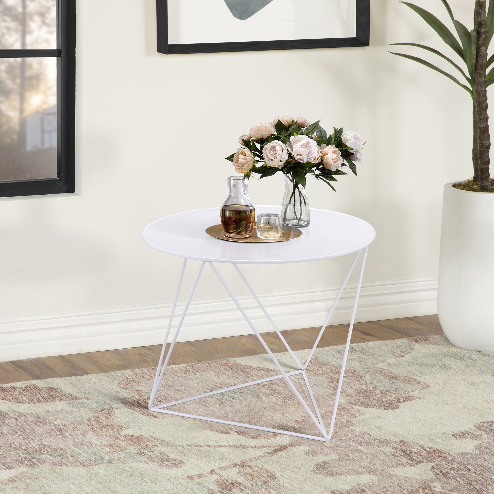 Modern white metal tripod accent table with round top perfect for living rooms