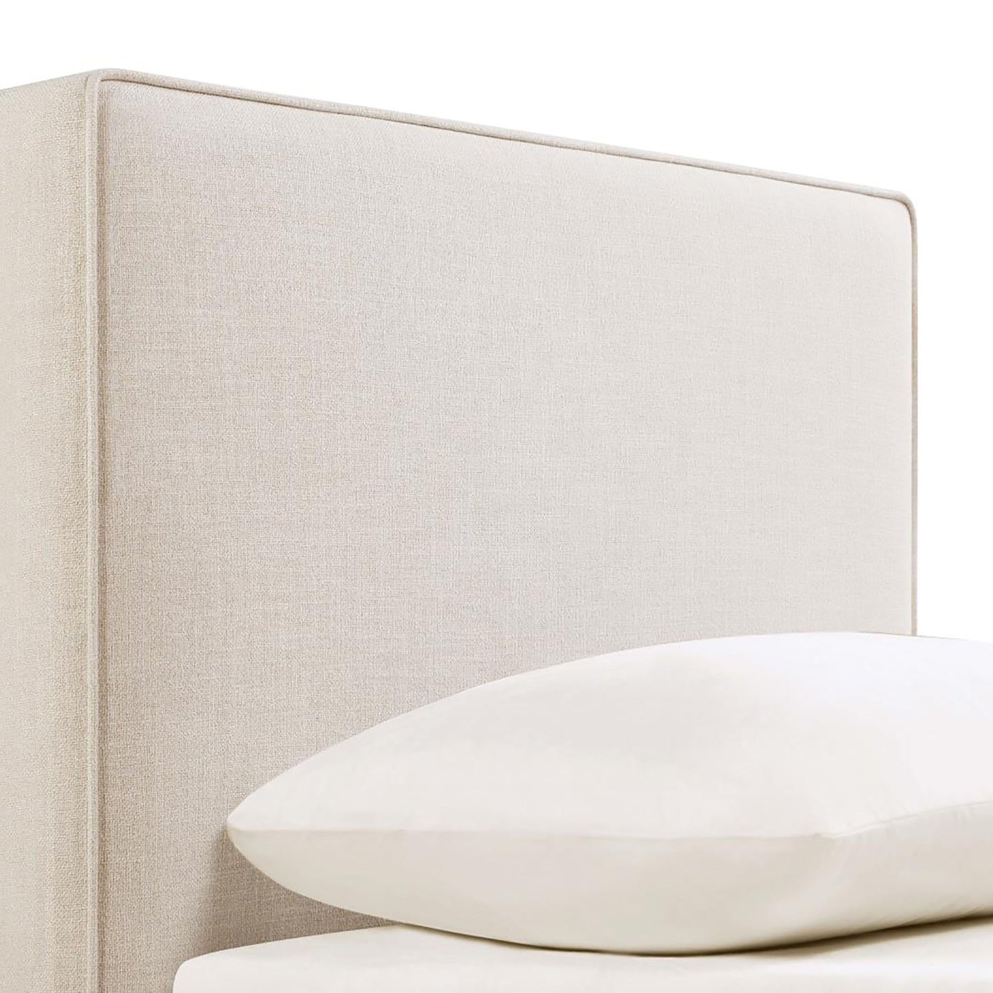 Upholstered beige headboard with a clean modern design ideal for any bedroom