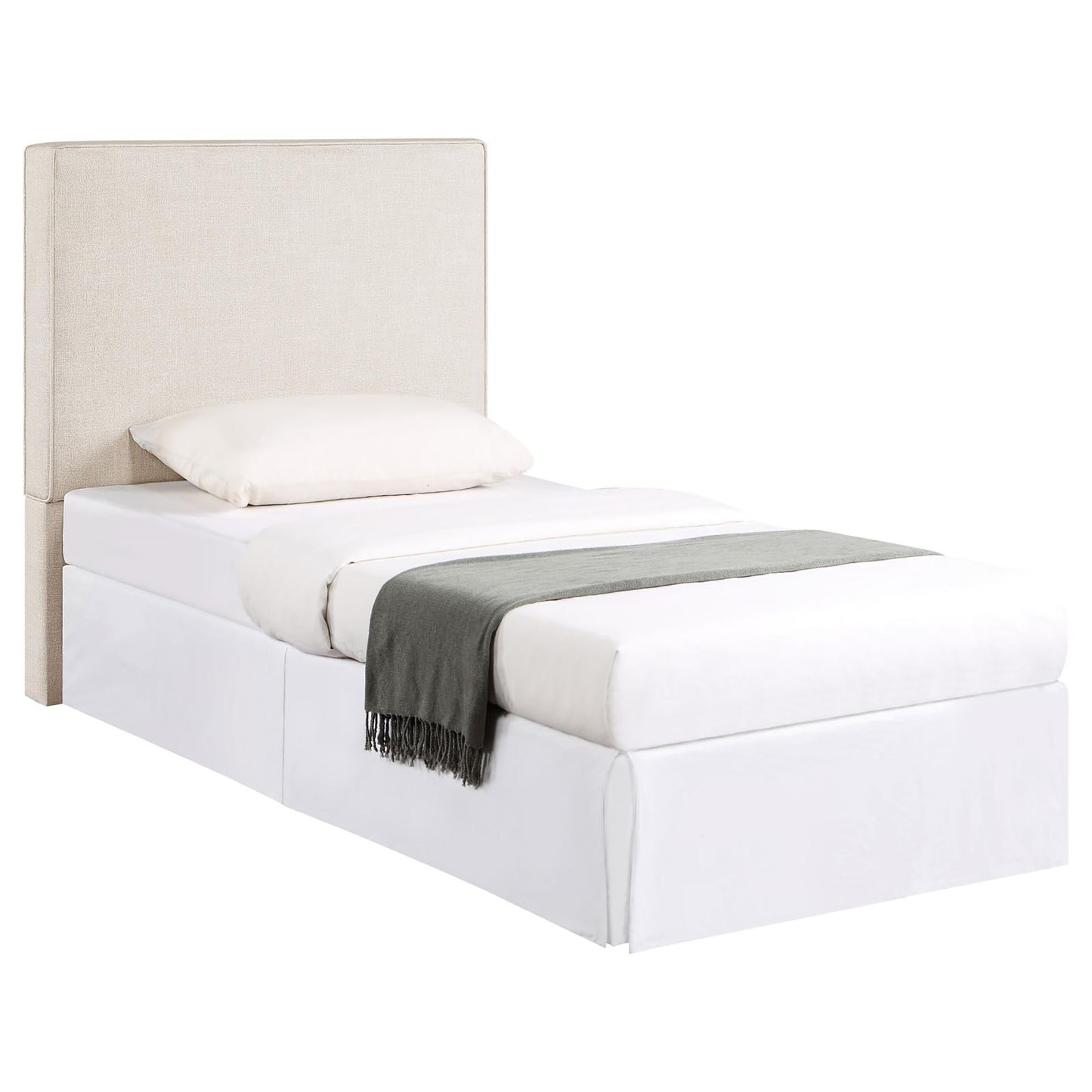 Upholstered twin bed frame in natural linen with a white duvet and grey throw blanket