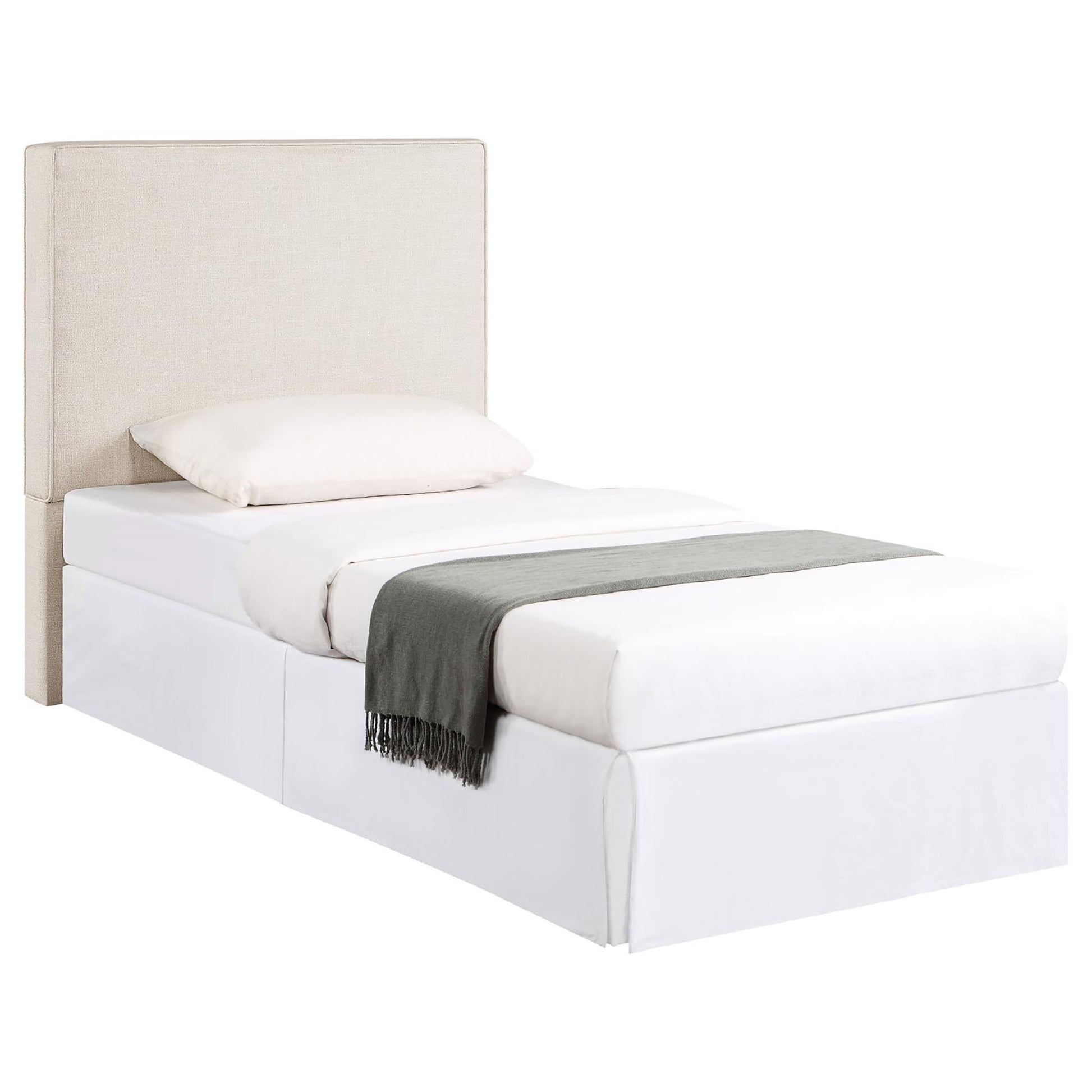 Upholstered twin bed frame in natural linen with a white duvet and grey throw blanket